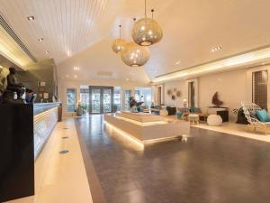 a large living room with couches and a lobby at Novotel Rayong Rim Pae Resort in Klaeng