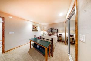 a bedroom with a bed and a mirror at Warm Springs Wonder in Ketchum