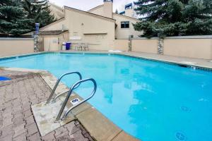 a large blue swimming pool with a chair in it at Warm Springs Wonder in Ketchum