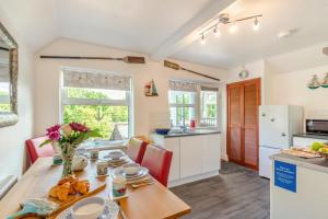 a kitchen and dining room with a table and chairs at 1 Bed in Filey oc-77710 in Hunmanby +20 photos