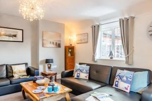 a living room with a couch and a table at 1 Bed in Filey oc-77710 in Hunmanby