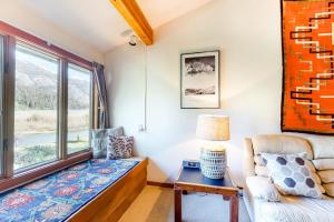 a living room with a couch and a window at 3223 Thimbleberry in Wilson