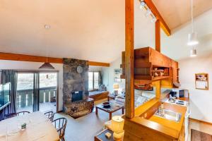 a kitchen and living room with a table and a sink at 3223 Thimbleberry in Wilson