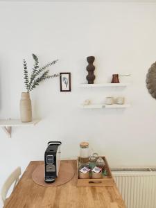 a table with a coffee maker on top of it at Bistra in Ajdovščina +6 photos