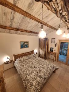 a bedroom with a large bed in a room at Eco romantica in Baratti
