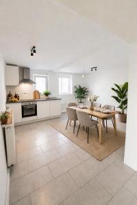 a kitchen and dining room with a table and chairs at Wohnhaus mit besonderer Ausstrahlung in Bad Frankenhausen