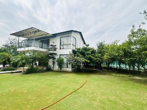 a house with a large lawn in front of it at Rk farms in Noida