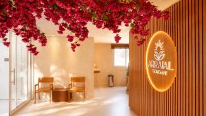 a lobby with chairs and a sign for a royal buffet at Arraial Concept Hotel in Arraial do Cabo
