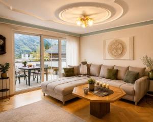 a living room with a couch and a table at Haus Bergharmonie in Tschagguns