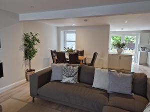 a living room with a couch and a table at Harbour View House in Ballycastle