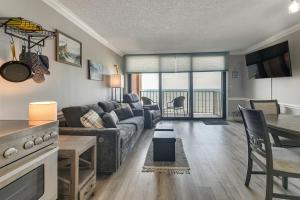 a living room with a couch and a table at Pool Access: 8th-Floor Condo on North Myrtle Beach in Myrtle Beach