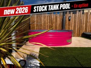 two large pink barrels sitting next to a fence at Suite avec Sauna 36m² in Niort