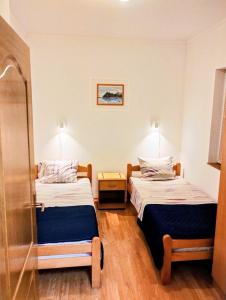 a room with two beds in a room at Apartment Bay View in Kotor