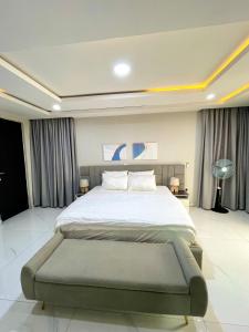 a bedroom with a large bed in a room at Luxurious Altitude in Lekki +10 photos