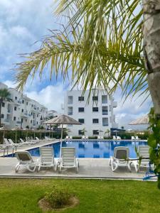 a group of lounge chairs next to a swimming pool at smir park Mdiq in M'diq