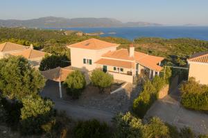an aerial view of a house with the ocean in the background at Skatza Ocean Crest in Kamária