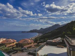 a view of the ocean from a building at La La Land in Letojanni