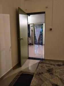 an open door to a room with a hallway at The Culture House in Mumbai +34 photos