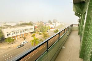 a balcony of a building with a view of a street at Fares Turis Hotel in Uruguaiana
