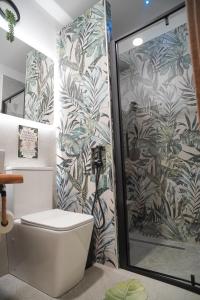 a bathroom with a shower with a toilet in it at Moonlight Jungle Suit Luxury experience in Avola +74 photos