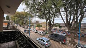 a view of a street with cars parked on the road at Escobar Apart CENTRO in Belén de Escobar