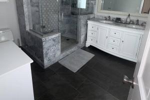 a bathroom with a shower and a sink at Glen Eagle Kingfisher Suite in Colorado Springs