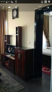 a bedroom with a desk and a bed and a mirror at Chalet in sharm el shekh in Sharm El Sheikh