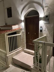 a entrance to a building with a wooden door at Borgo Bianco in Vieste