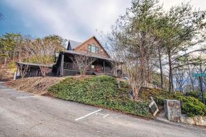 a house on a hill with a driveway at The Nut House in Sevierville