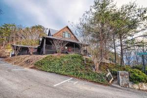 a house on a hill with a driveway at The Burrows in Sevierville