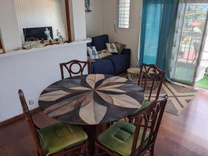 a room with a table and chairs and a couch at La résidence du sportif Bernard in Anse-Bertrand +87 photos