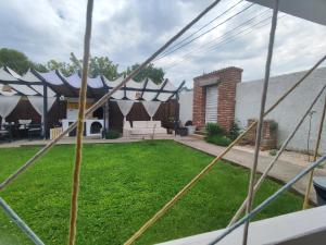 a backyard with a black and white marquee at Casa FaRa in Vama Veche
