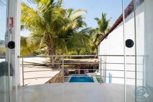 a view of the pool from the balcony of a resort at Sumarfe in Máncora