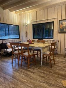 a wooden table and chairs in a room at Casa punta de lobos in Pichilemu