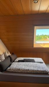 a bed in a room with a window at Haus Bergblick in Olsberg