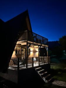 a house at night with the lights on at Komarnica Forest Owl 2 in Šavnik