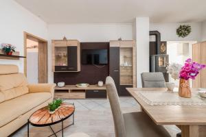 a living room with a couch and a table at Apartments Ivan in Vir