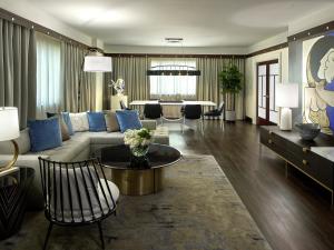 a living room with a couch and a table at Sofitel Philadelphia at Rittenhouse Square in Philadelphia