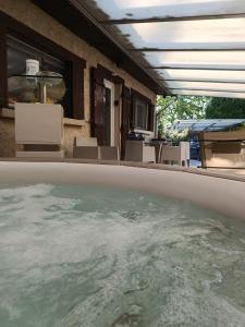 a view of a pool of water in a house at Le Coq de Champagne in Dormans