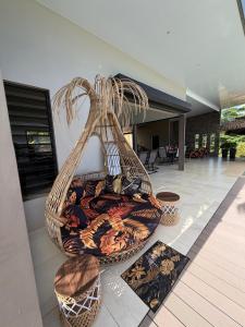 a large vase sitting on the floor of a house at Villa Maeva Tahiti in Vaihi