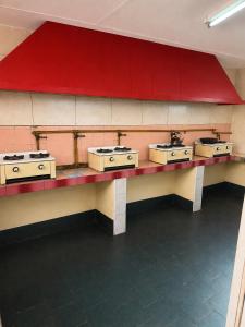 a row of sinks on a wall in a room at Hotel Histórico San Telmo in Buenos Aires