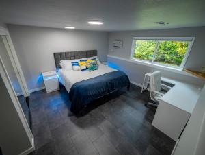 a bedroom with a bed and a window at Remodeled 2BR, Chic and Cozy in Shoreline