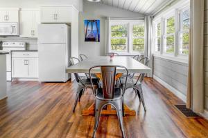 a kitchen with a table and chairs and a refrigerator at Westeros by Simple Life Rentals in Ephraim