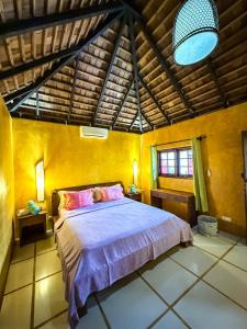 a bedroom with a large bed in a room at Villa Mitirapa in Tohautu +192 photos