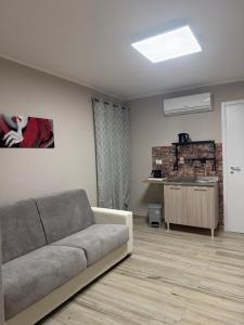 a living room with a couch and a table at Dimora Leonida in Taranto