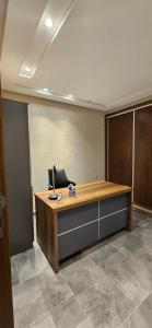 an office cubicle with a desk with a phone on it at Andre Luxury Apart in Laayoune