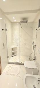 a bathroom with a shower and a toilet and a sink at Andre Luxury Apart in Laayoune +22 photos