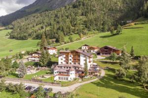 an aerial view of a resort in the mountains at Replers Hotel garni & Appartements in Prägraten