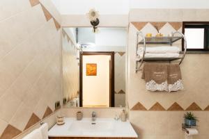a bathroom with a sink and a mirror at GrandPa's House in Sorrento +26 photos