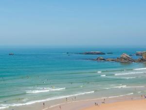 a group of people in the water at a beach at Ibis Irun in Irún +116 photos